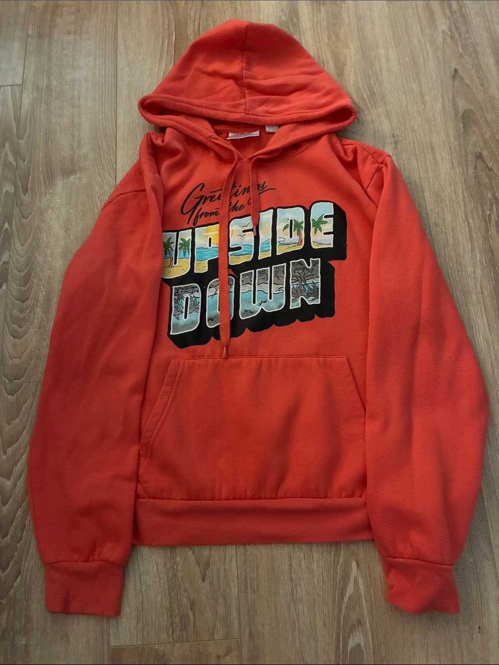 Bright Orange Zip-Up Hooded Sweater with 'Upside Down' Graphic